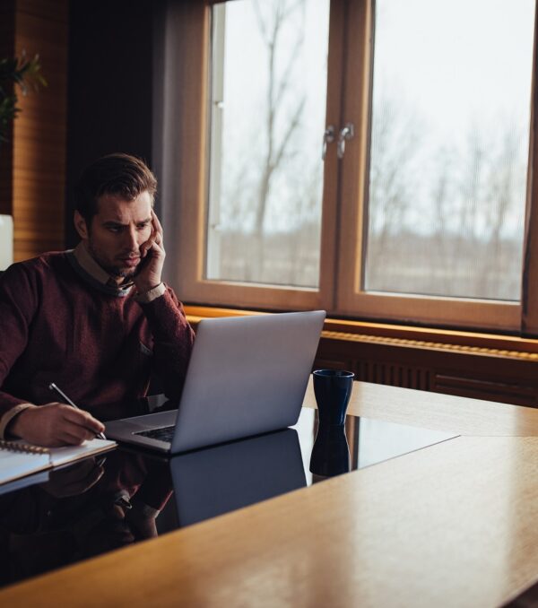 He's a professional at problem solving Young businessman working in his office