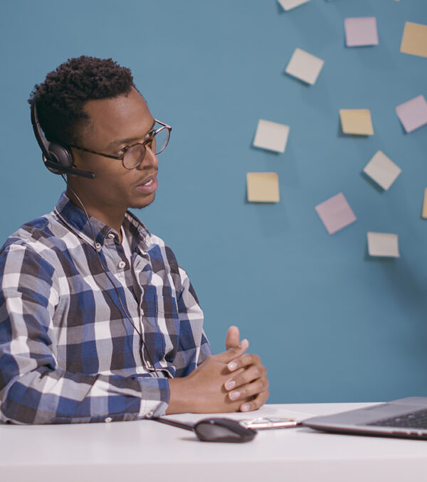 Helpline operator giving telemarketing assistance and support Helpline operator giving telemarketing assistance and support at client care call center, talking on phone call with people. Sales adviser using microphone and headphones at customer service.