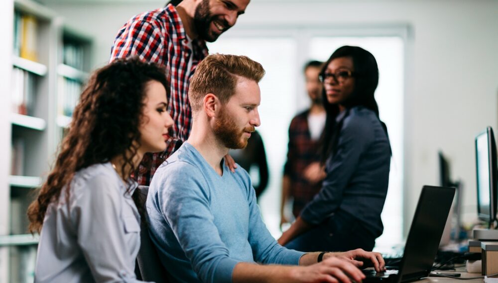Portrait of programmers working together in development software company
