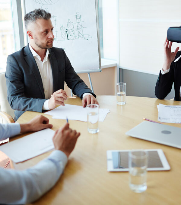 Testing innovation Group of modern managers testing new technological gadget